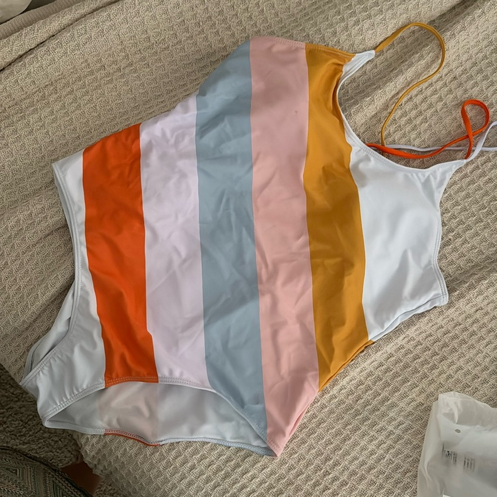 Multi color one piece swimsuit. Never been worn, new with tags.